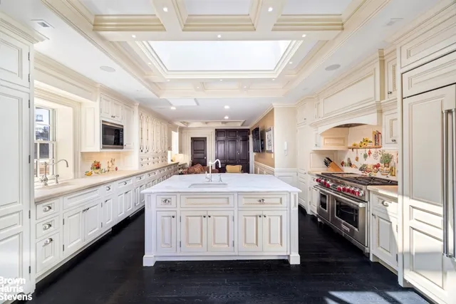 a kitchen with stainless steel appliances granite countertop a stove and a refrigerator