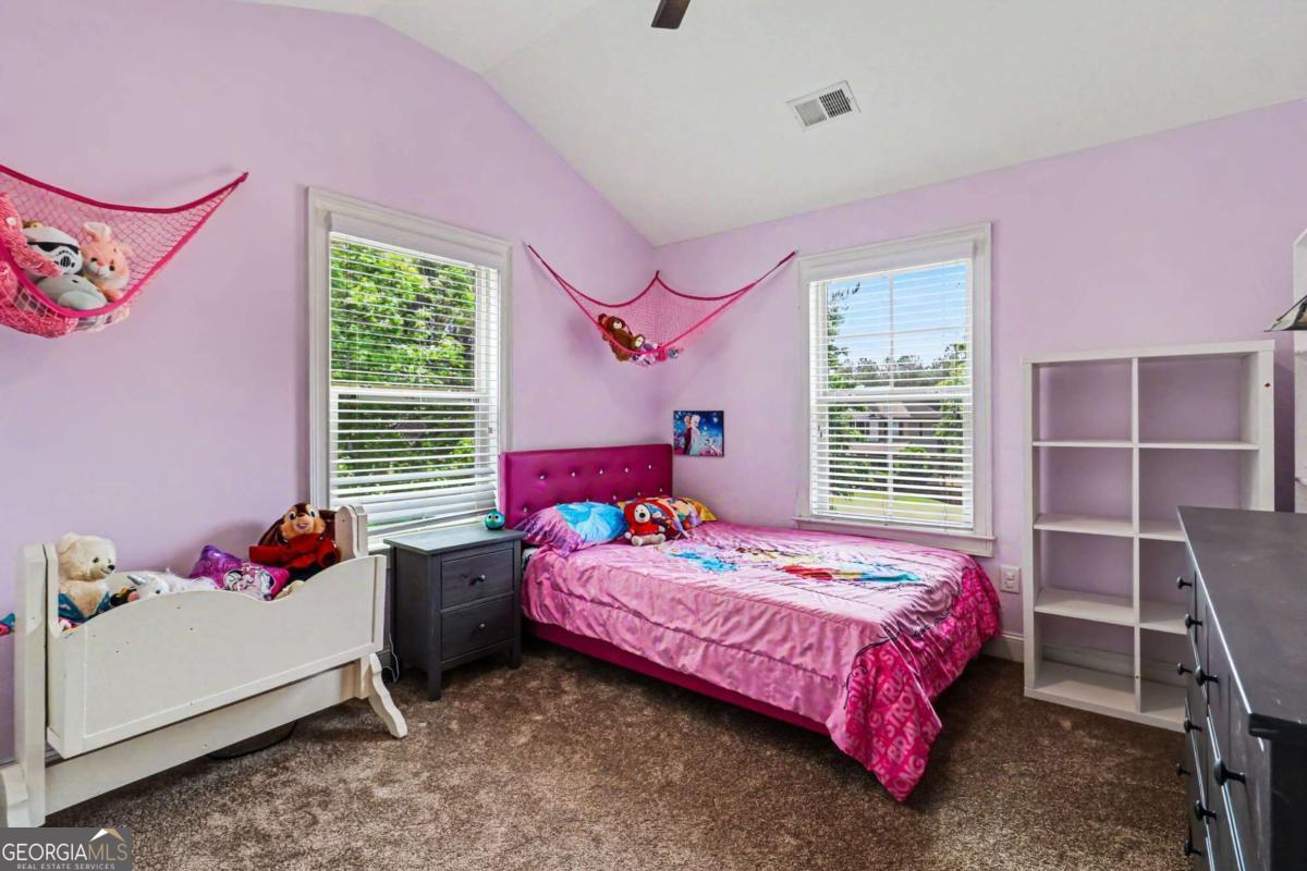 207 George Wynn Road Palmetto, GA 30268 - Photo 21 of 32 a bedroom with a bed and a window