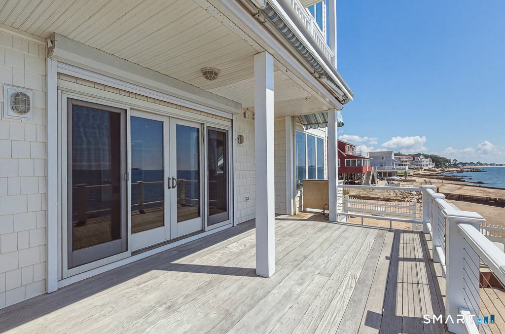167 Shore Road Clinton, CT 06413 - Photo 8 of 40 The living room and sunroom provide access to the main level deck
