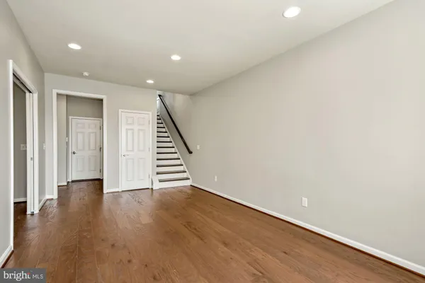a view of an entryway with wooden floor