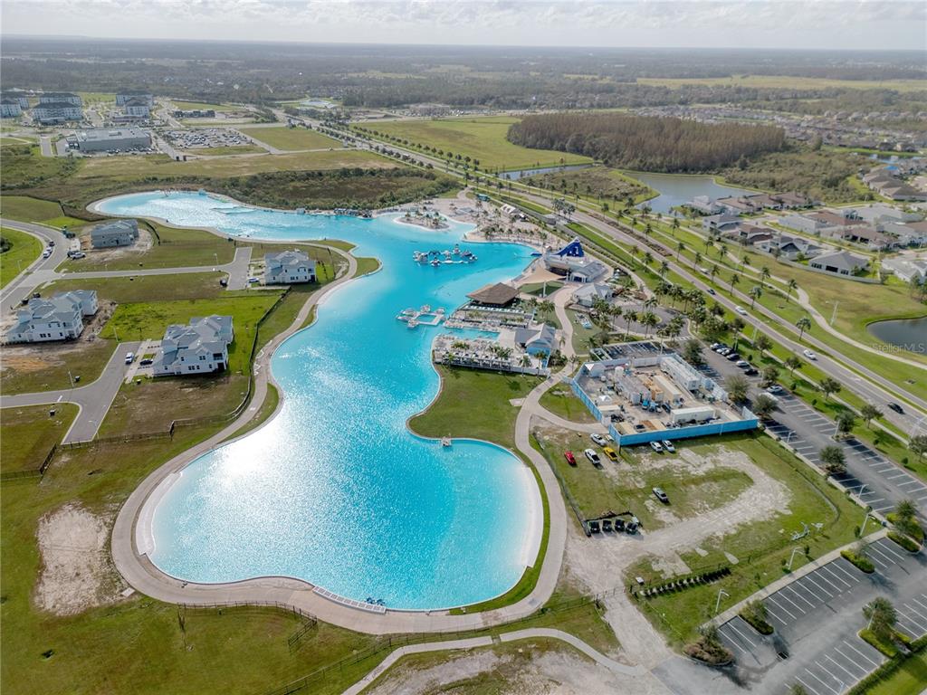 8309 Hardy Bay Loop Wesley Chapel, FL 33545 - Photo 12 of 24 an aerial view of a swimming pool with a mountain view
