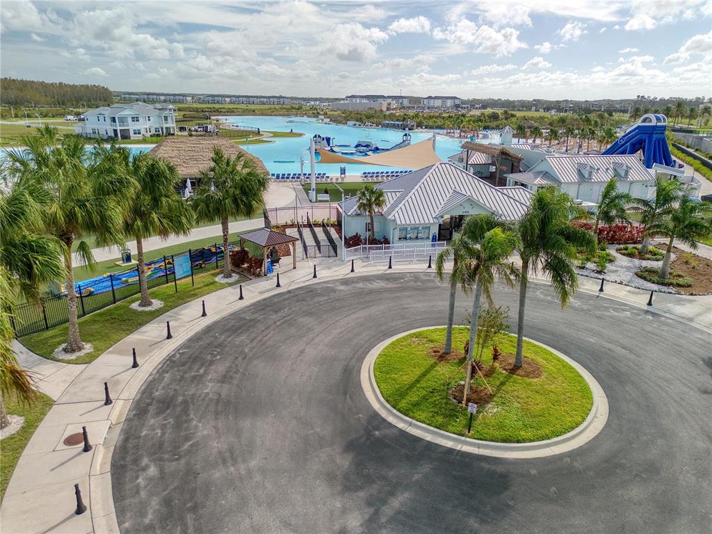 8309 Hardy Bay Loop Wesley Chapel, FL 33545 - Photo 15 of 24 a view of a swimming pool with a table and chairs