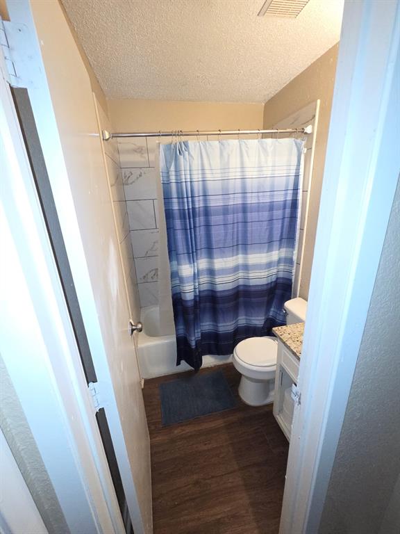 744 Sycamore Street, Unit 74 Paris, TX 75460 - Photo 10 of 10 a bathroom with a toilet a sink and a shower