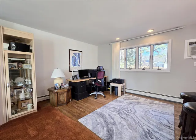 a living room with furniture window and a wooden floor