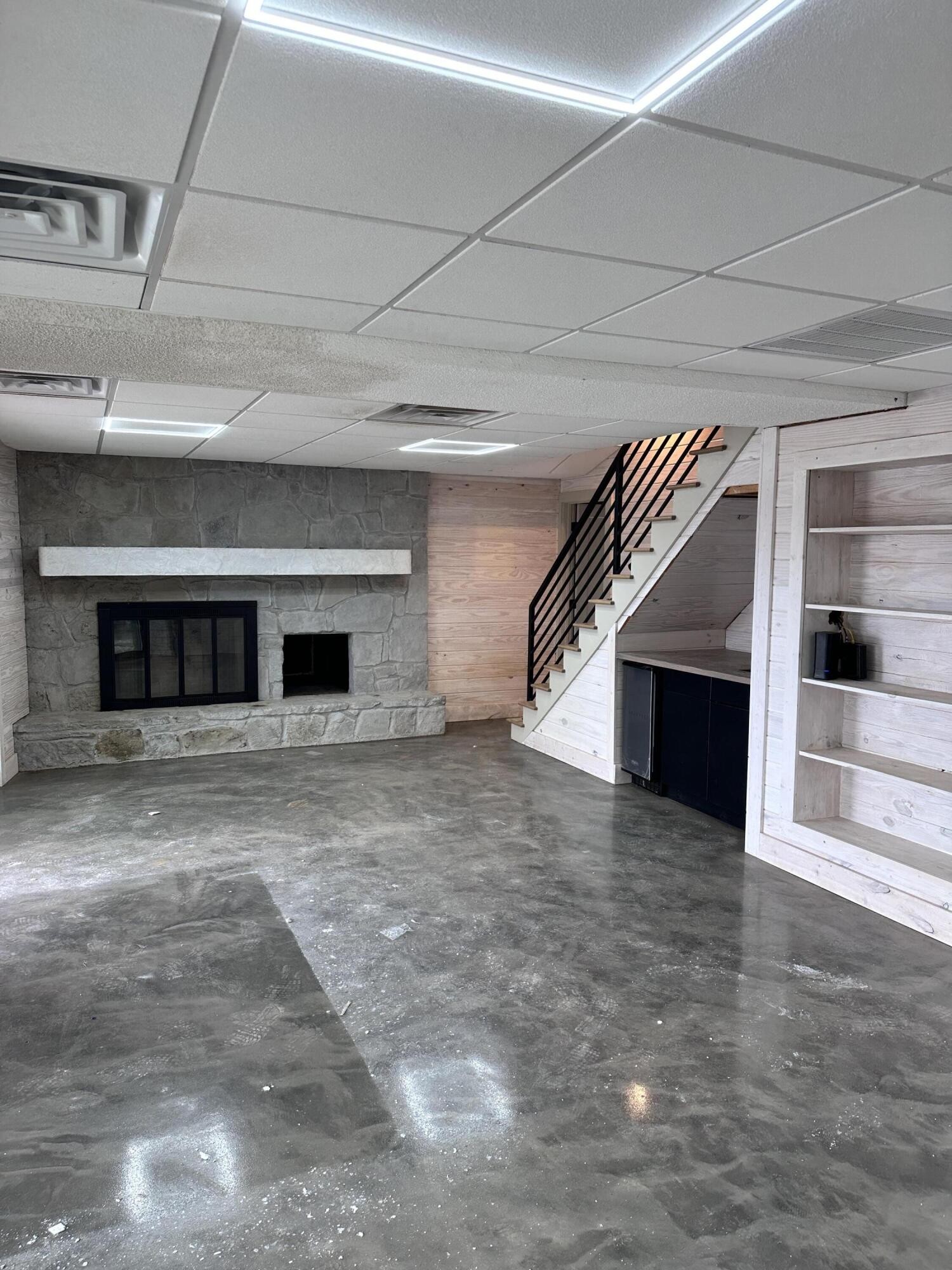 260 Windmill Lane Georgetown, TN 37336 - Photo 16 of 19 a view of empty room with wooden floor fireplace and staircase