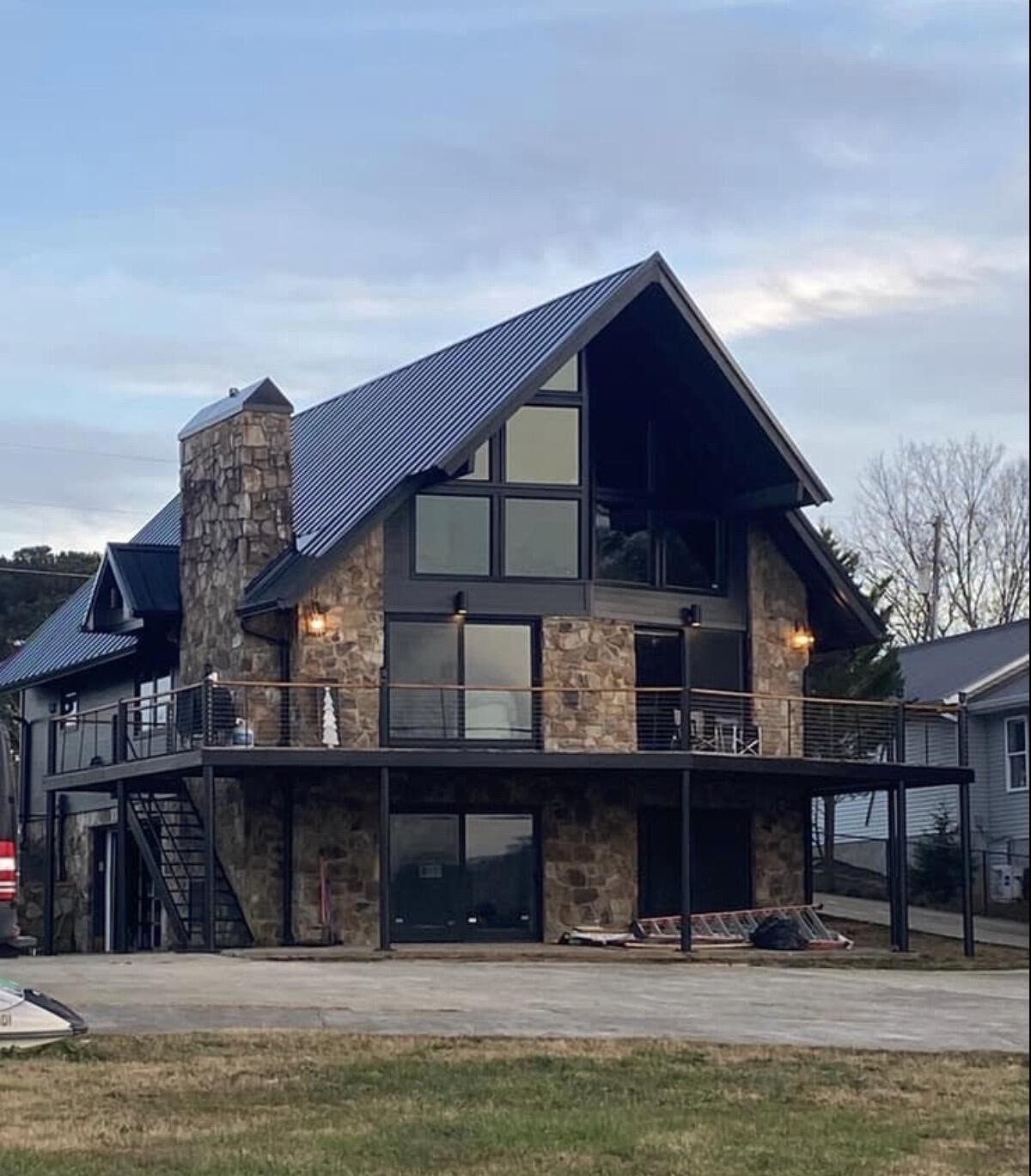 260 Windmill Lane Georgetown, TN 37336 - Photo 3 of 19 a front view of building with glass windows and a floor