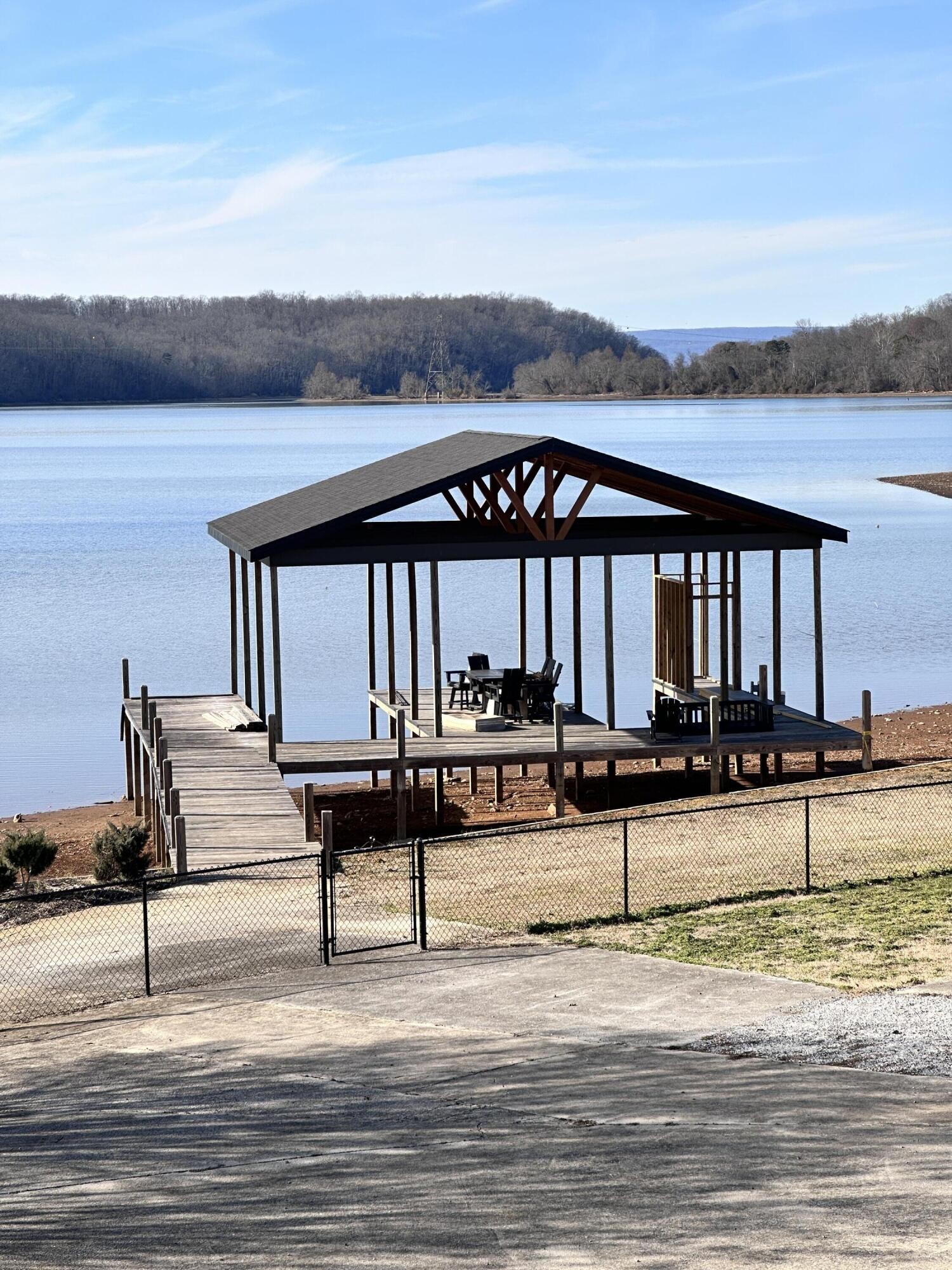 260 Windmill Lane Georgetown, TN 37336 - Photo 5 of 19 a view of a swimming pool with seating area and lake view
