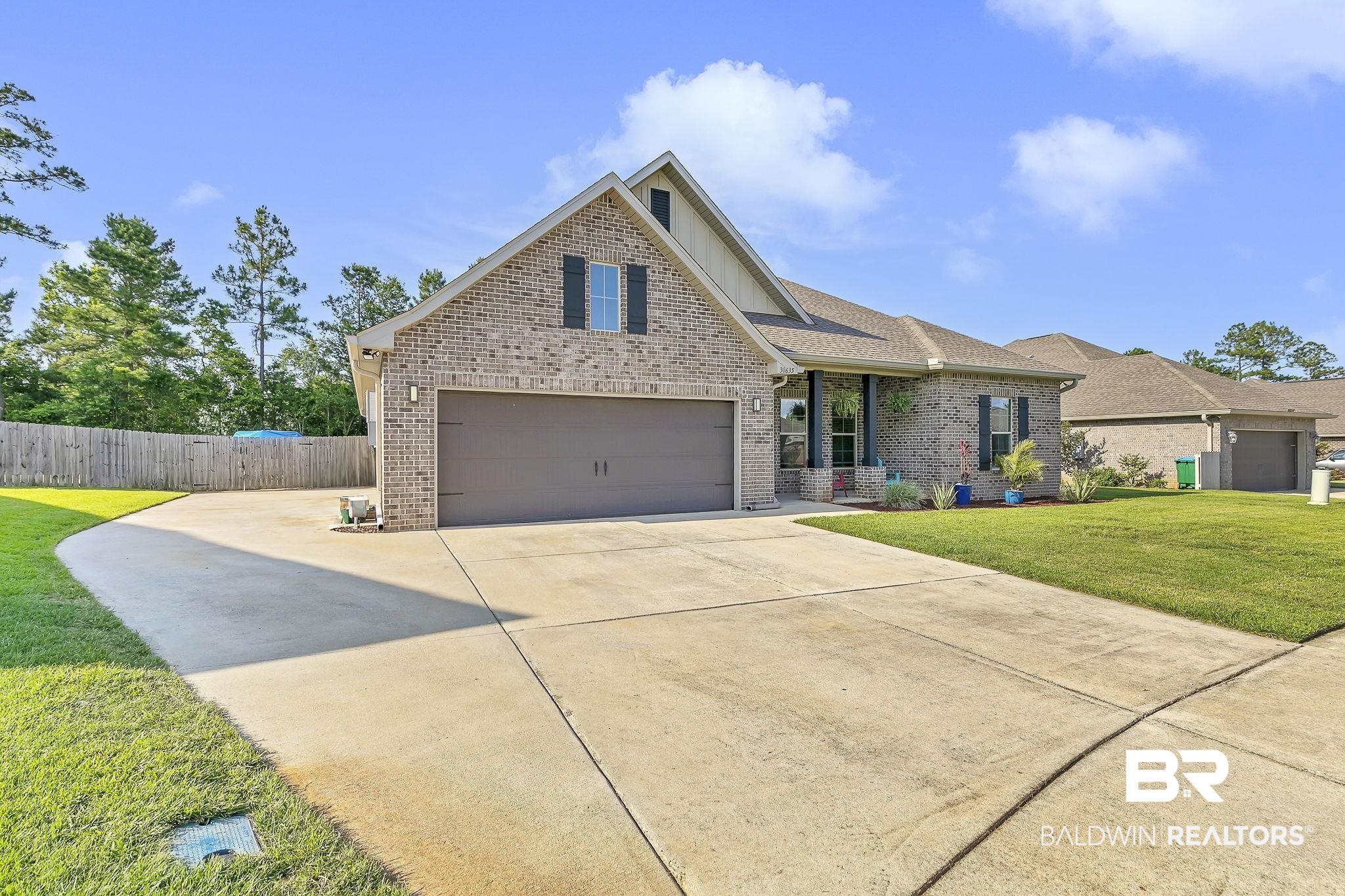 30635 Drayton Court Daphne, AL 36527 - Photo 3 of 51 View of front of property with brick siding, driveway, and a garage