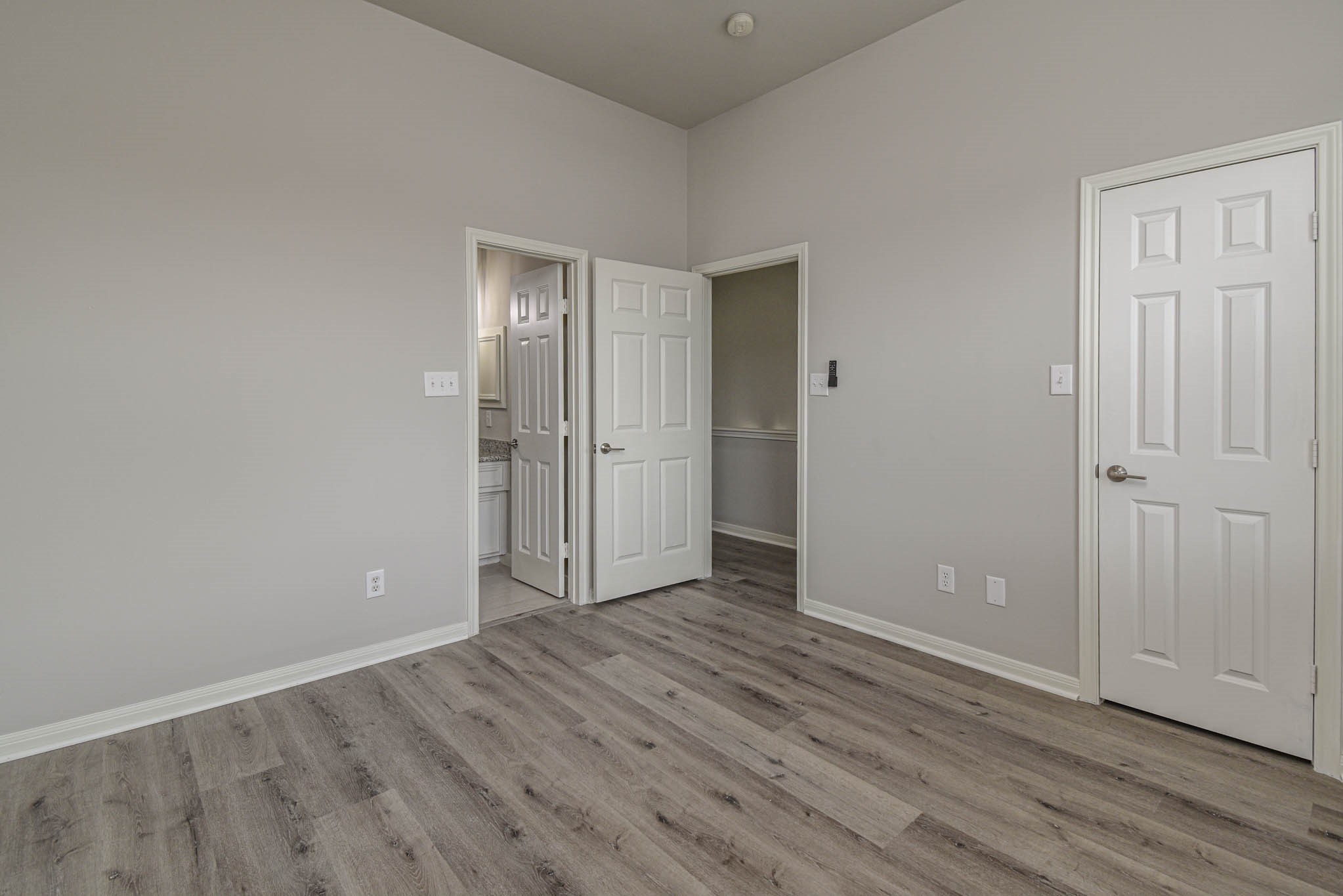 1729 Tuam Street Houston, TX 77004 - Photo 13 of 23 a view of an empty room with wooden floor and closet area