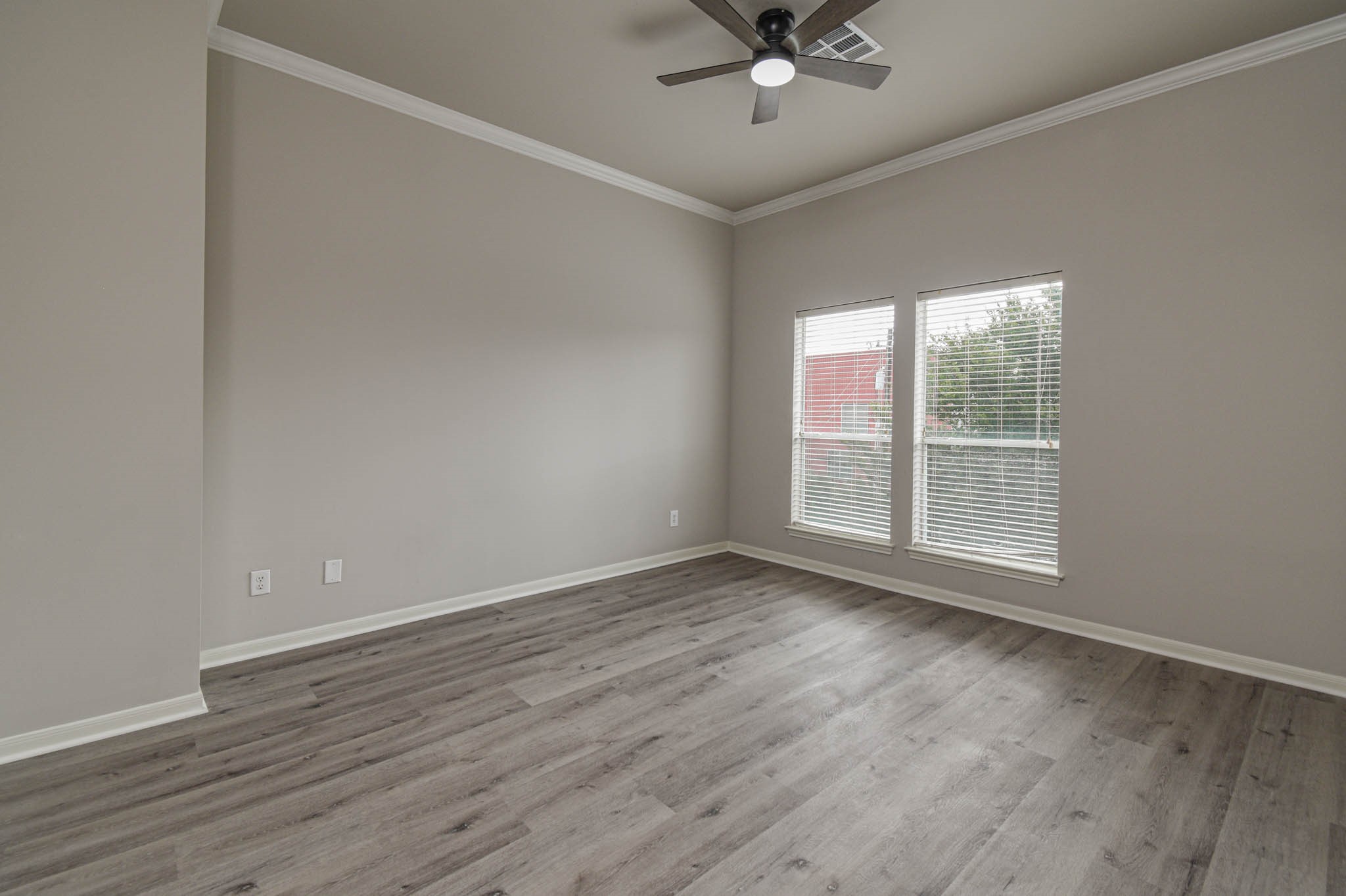 1729 Tuam Street Houston, TX 77004 - Photo 14 of 23 a view of an empty room with wooden floor and a window