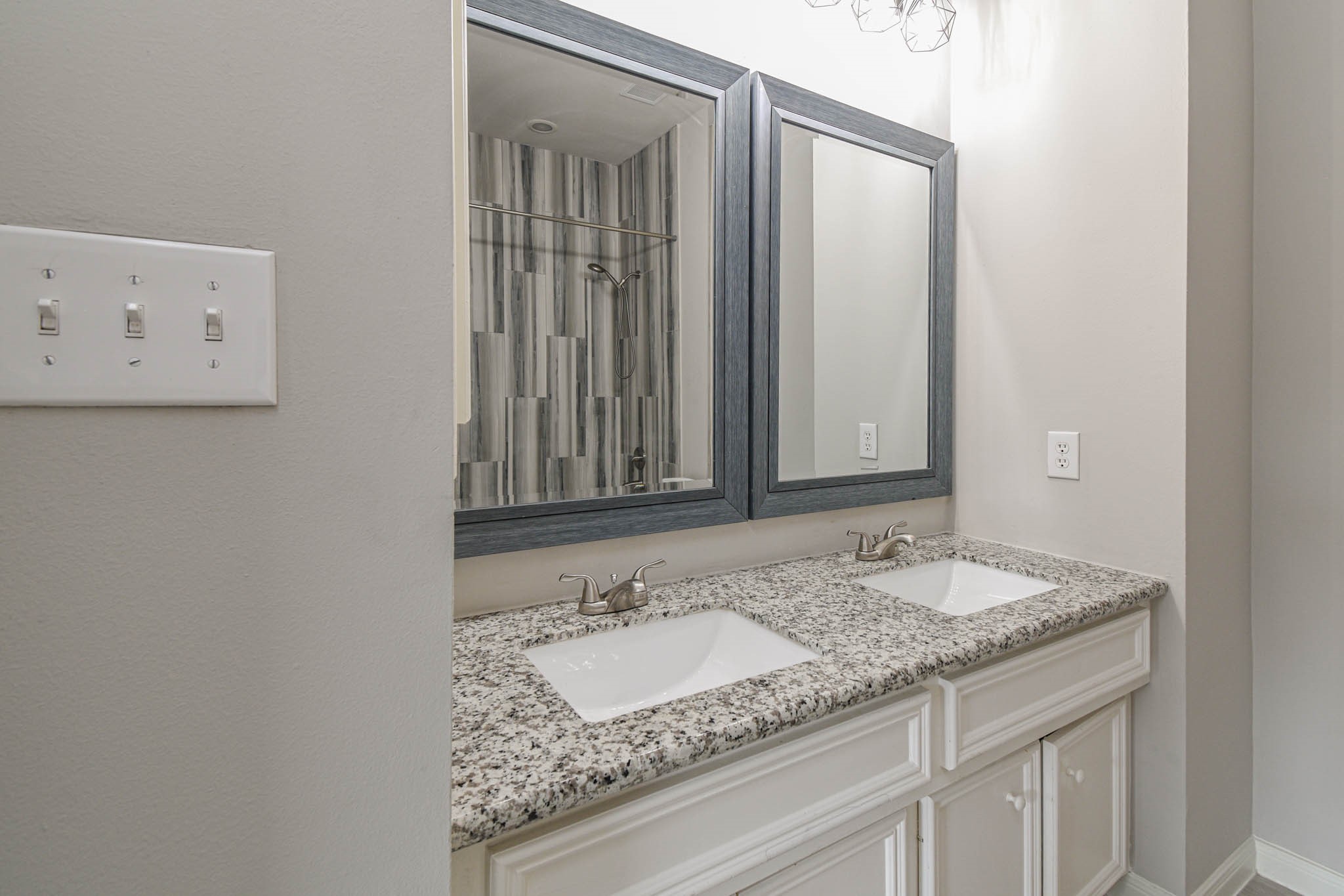 1729 Tuam Street Houston, TX 77004 - Photo 17 of 23 a bathroom with a granite countertop sink and a mirror