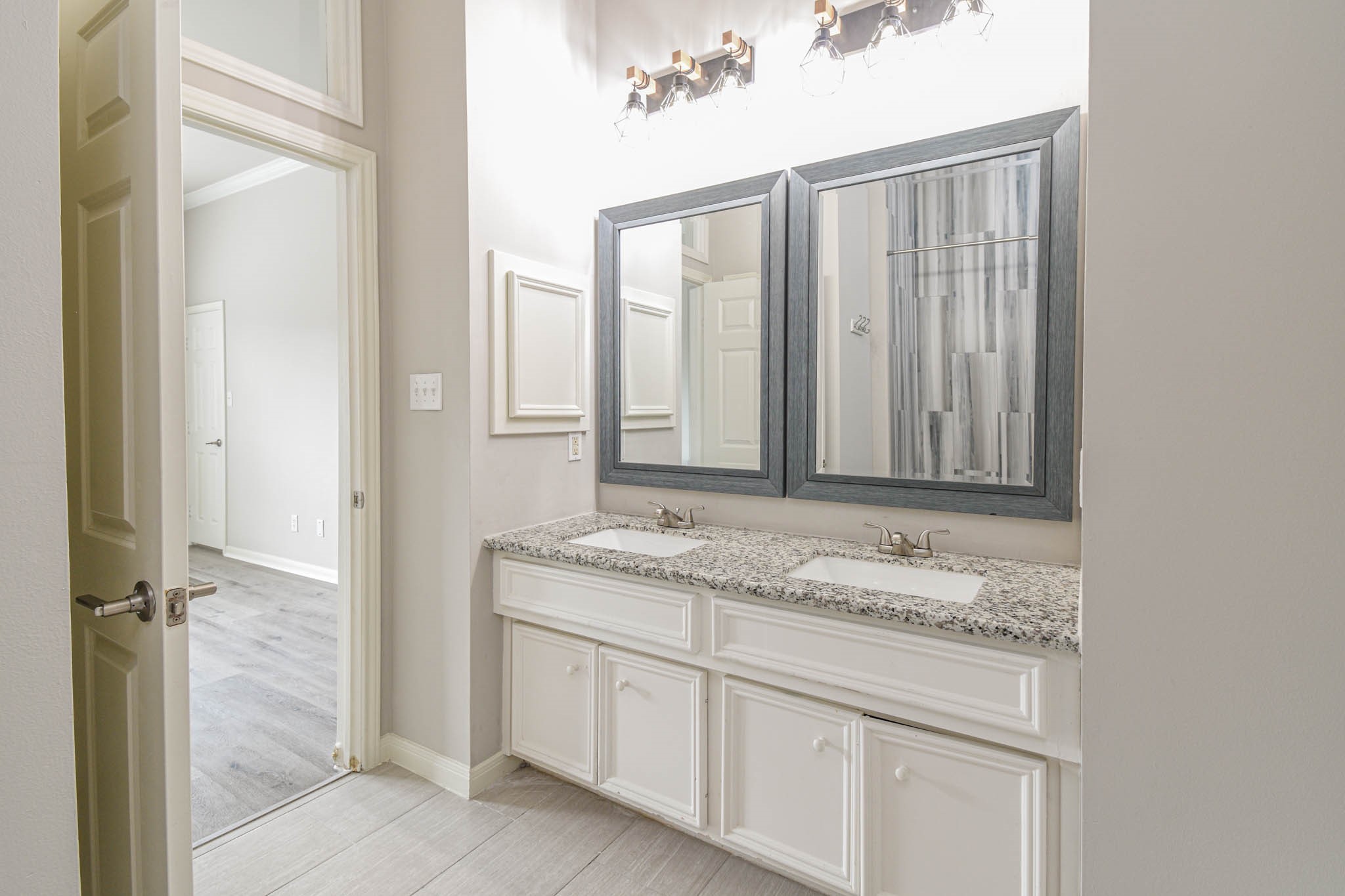 1729 Tuam Street Houston, TX 77004 - Photo 19 of 23 a bathroom with a granite countertop sink and a mirror