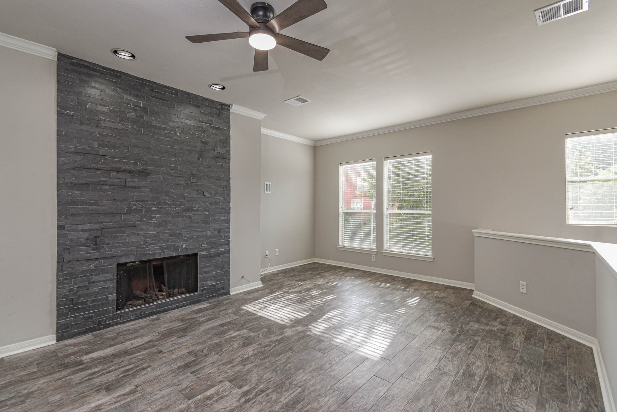 1729 Tuam Street Houston, TX 77004 - Photo 2 of 23 a view of empty room with wooden floor and fan