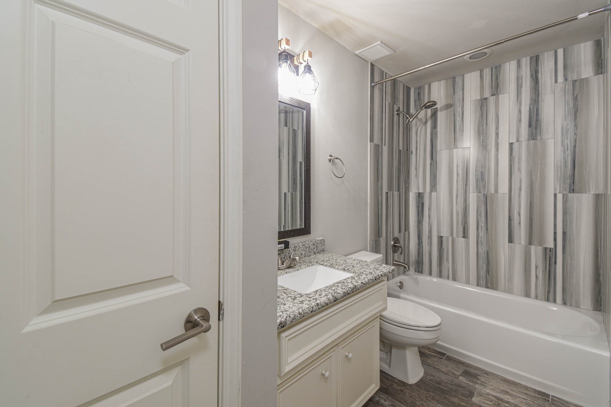 1729 Tuam Street Houston, TX 77004 - Photo 21 of 23 a bathroom with a granite countertop sink toilet and shower