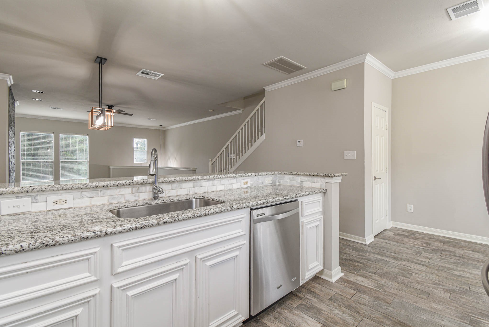 1729 Tuam Street Houston, TX 77004 - Photo 6 of 23 a kitchen with a sink and a refrigerator