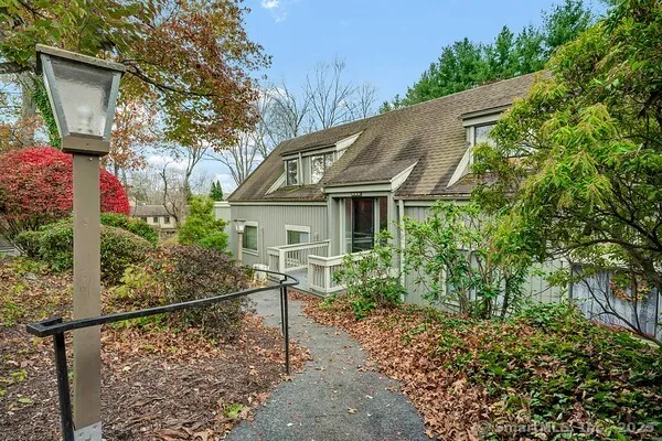 a house with trees in the background