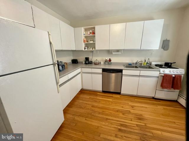 225 B Dewey Drive, Unit B Annapolis, MD 21401 - Photo 8 of 15 a kitchen with white cabinets and white appliances