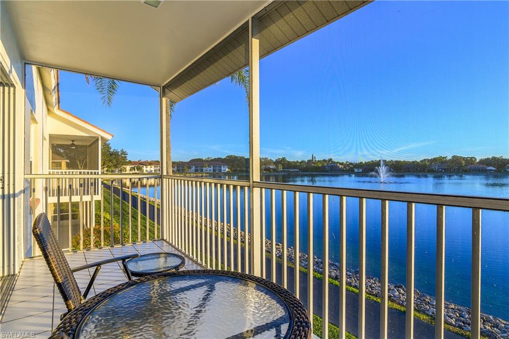 541 Windsor Square, Unit 202 Naples, FL 34104 - Photo 26 of 36 a view of balcony with wooden floor and seating space