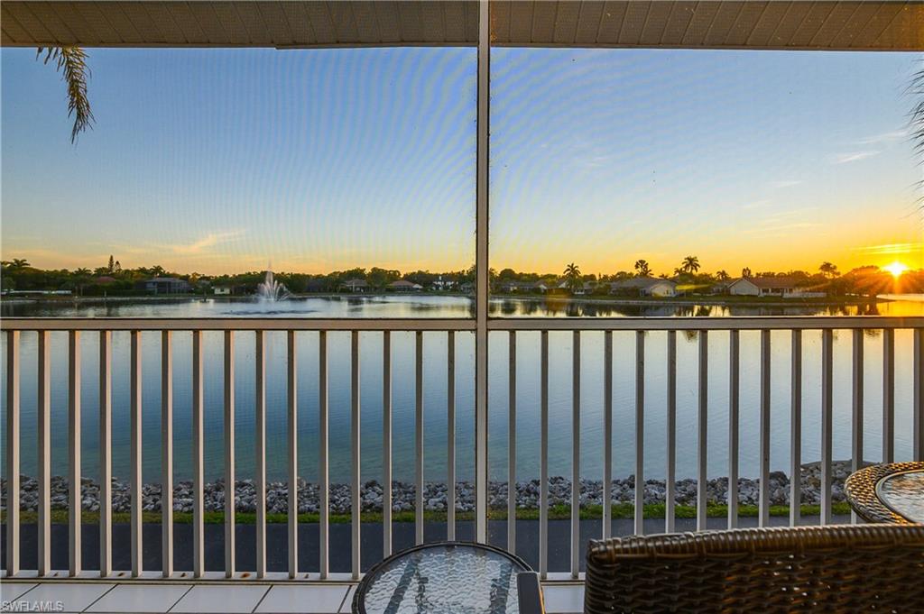 541 Windsor Square, Unit 202 Naples, FL 34104 - Photo 27 of 36 a view of a wooden fence