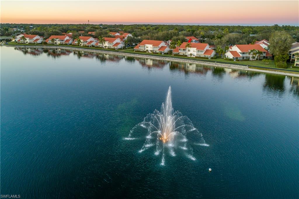 541 Windsor Square, Unit 202 Naples, FL 34104 - Photo 29 of 36 a view of a lake with houses