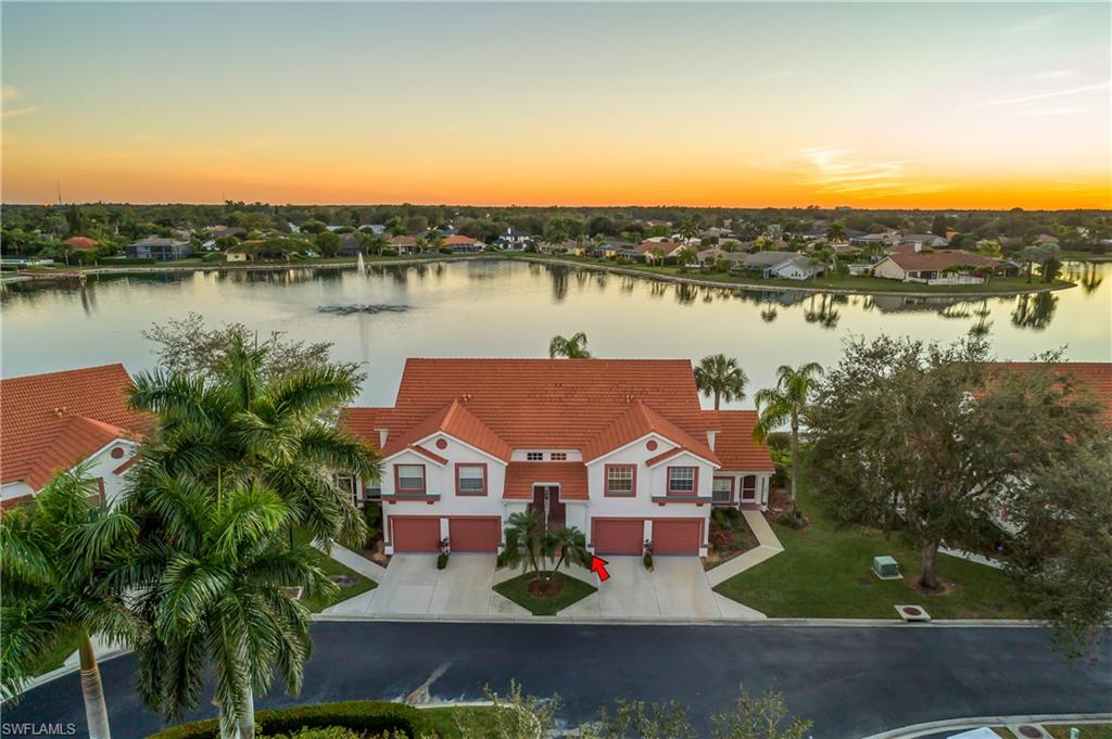 541 Windsor Square, Unit 202 Naples, FL 34104 - Photo 3 of 36 an aerial view of residential houses with outdoor space and lake view