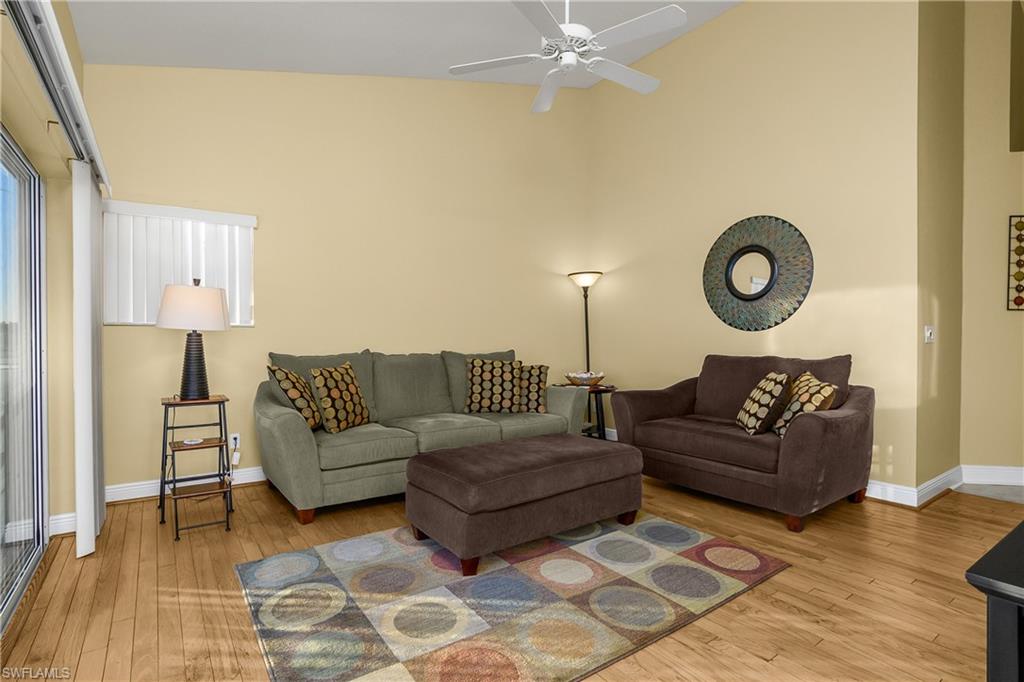 541 Windsor Square, Unit 202 Naples, FL 34104 - Photo 9 of 36 a living room with couches and a coffee table