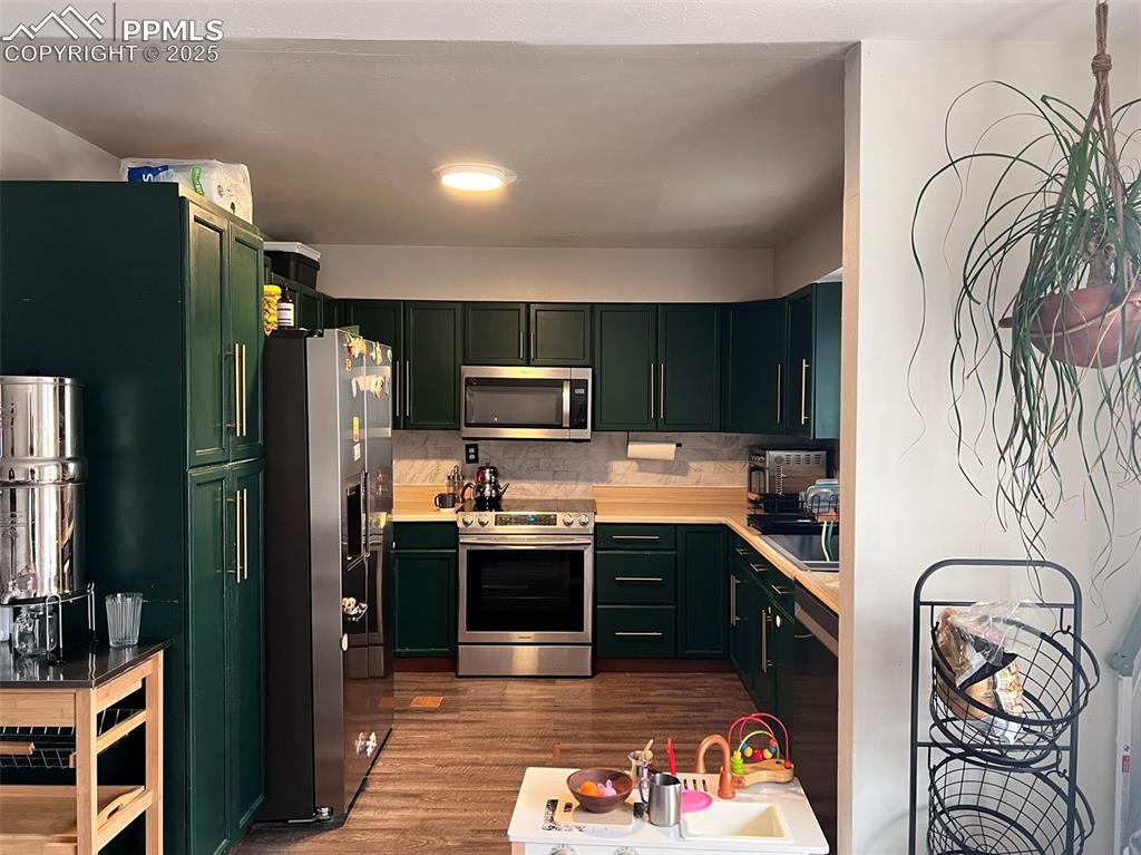 3704 Indianpipe Circle Colorado Springs, CO 80918 - Photo 2 of 12 a kitchen with stainless steel appliances granite countertop a refrigerator and a stove