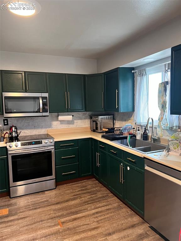 3704 Indianpipe Circle Colorado Springs, CO 80918 - Photo 4 of 12 a kitchen with a sink appliances and cabinets