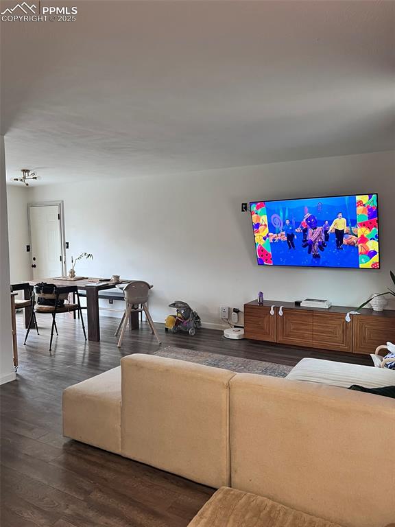 3704 Indianpipe Circle Colorado Springs, CO 80918 - Photo 5 of 12 a living room with furniture and painting on the wall