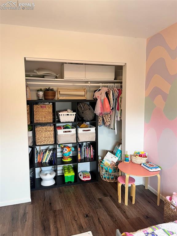 3704 Indianpipe Circle Colorado Springs, CO 80918 - Photo 8 of 12 a living room with furniture and a wooden floor
