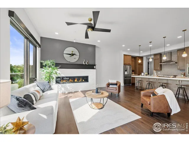 a living room with furniture and a clock