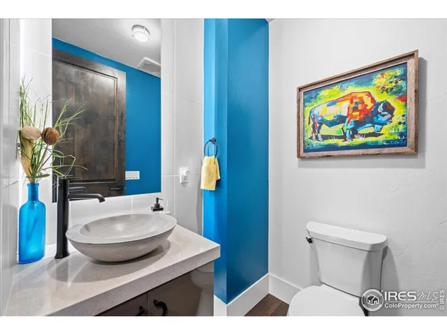 a bathroom with a sink a vanity and a mirror
