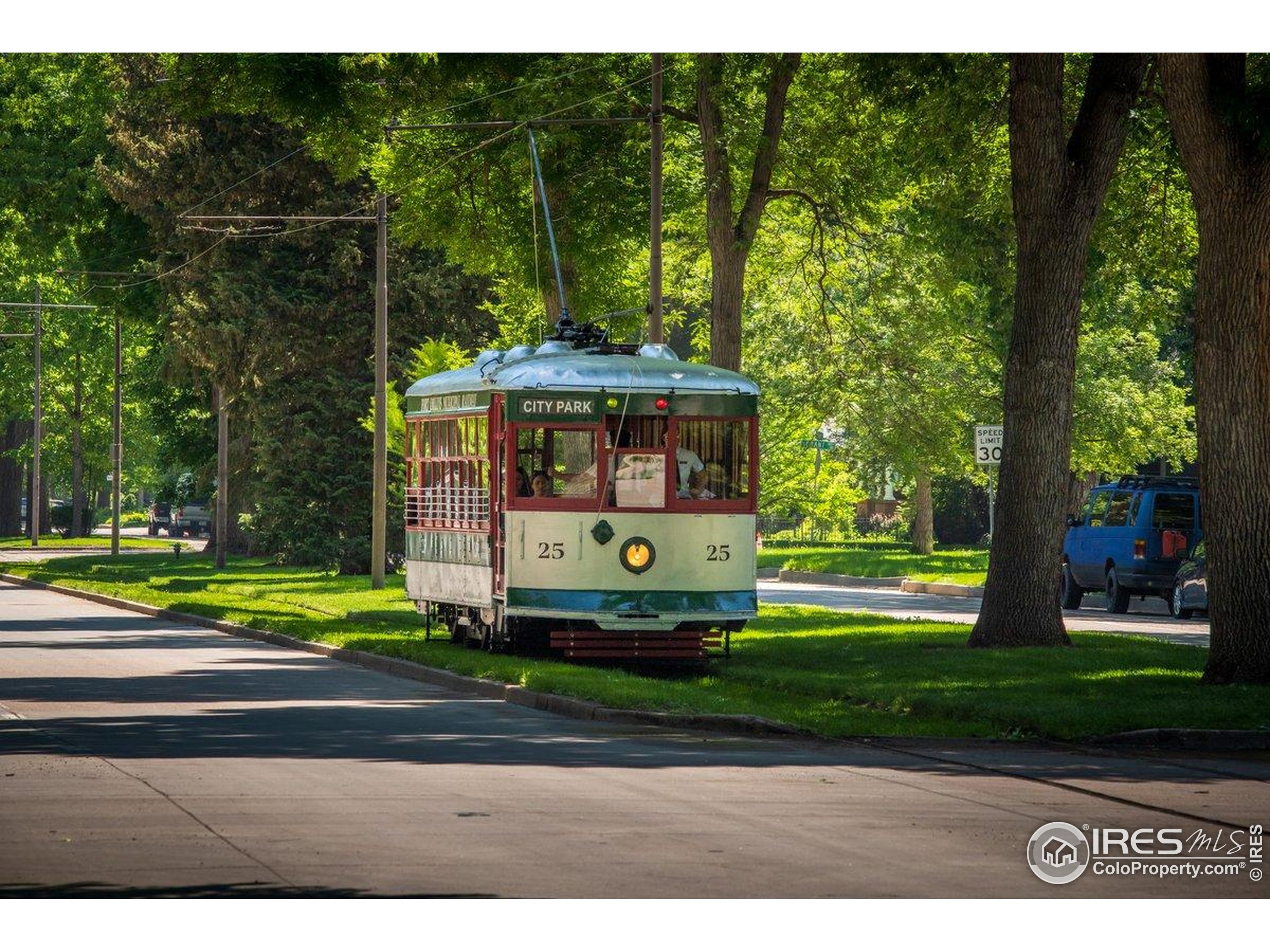 302 North Meldrum Street, Unit 313 Fort Collins, CO 80521 - Photo 25 of 36 a front view of a house with a garden and trees