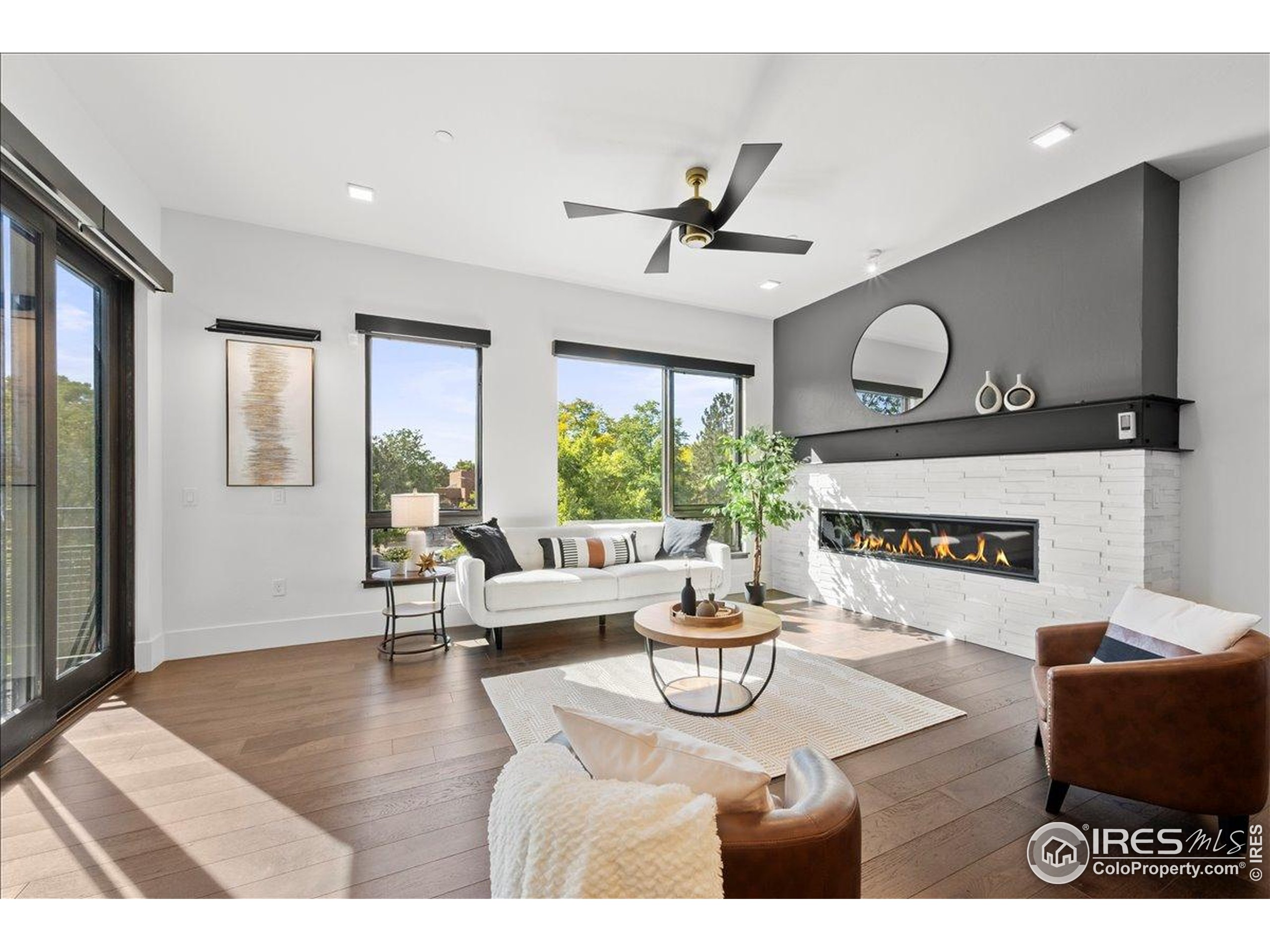 302 North Meldrum Street, Unit 313 Fort Collins, CO 80521 - Photo 5 of 36 a living room with furniture and a large window