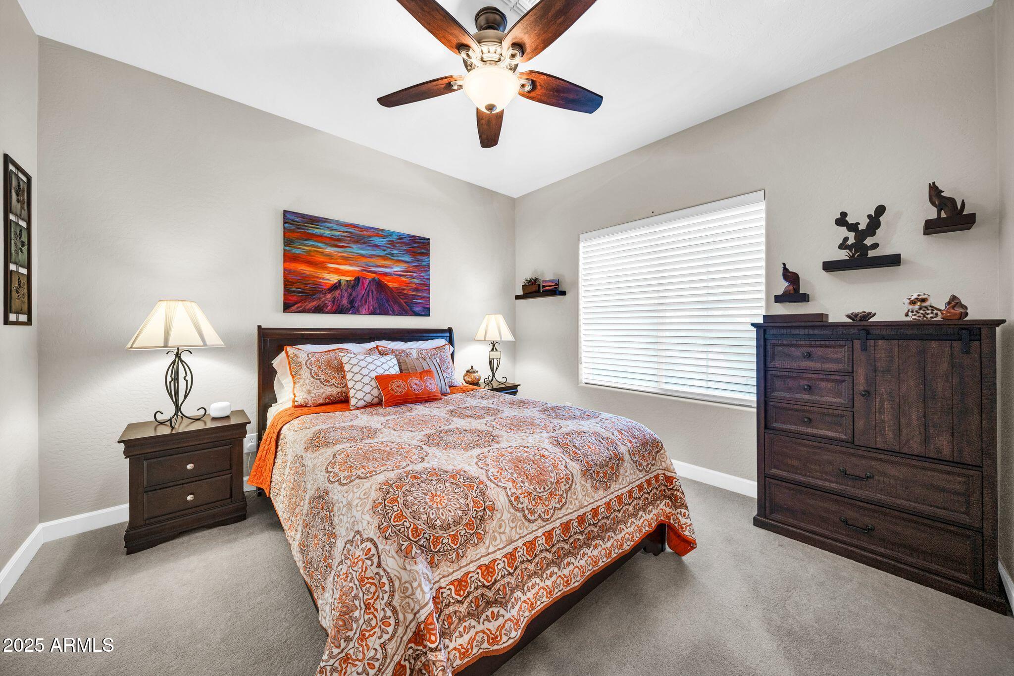 41822 North Crooked Stick Road Anthem, AZ 85086 - Photo 28 of 90 a bedroom with a bed and dresser