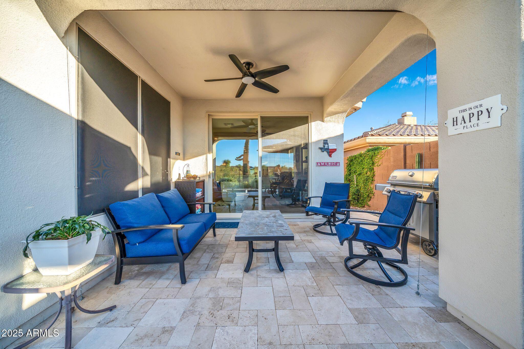 41822 North Crooked Stick Road Anthem, AZ 85086 - Photo 39 of 90 a living room with furniture and a potted plant