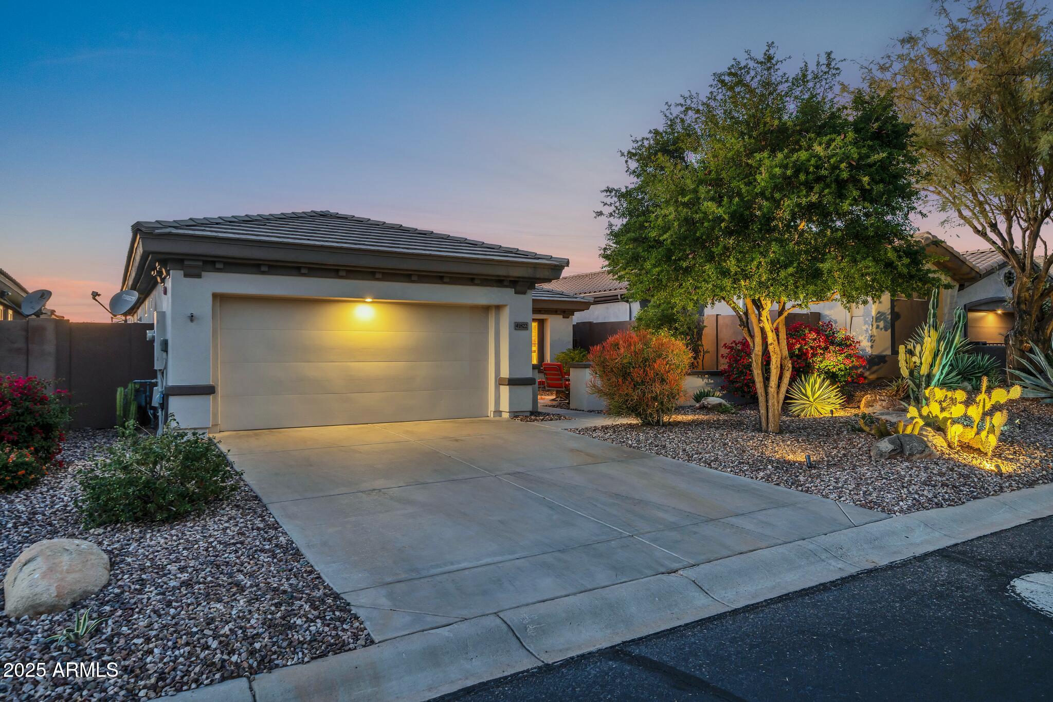 41822 North Crooked Stick Road Anthem, AZ 85086 - Photo 56 of 90 a front view of a house with garden