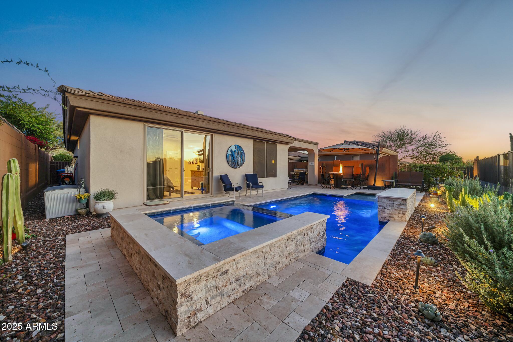 41822 North Crooked Stick Road Anthem, AZ 85086 - Photo 63 of 90 a living room with furniture a swimming pool and a yard