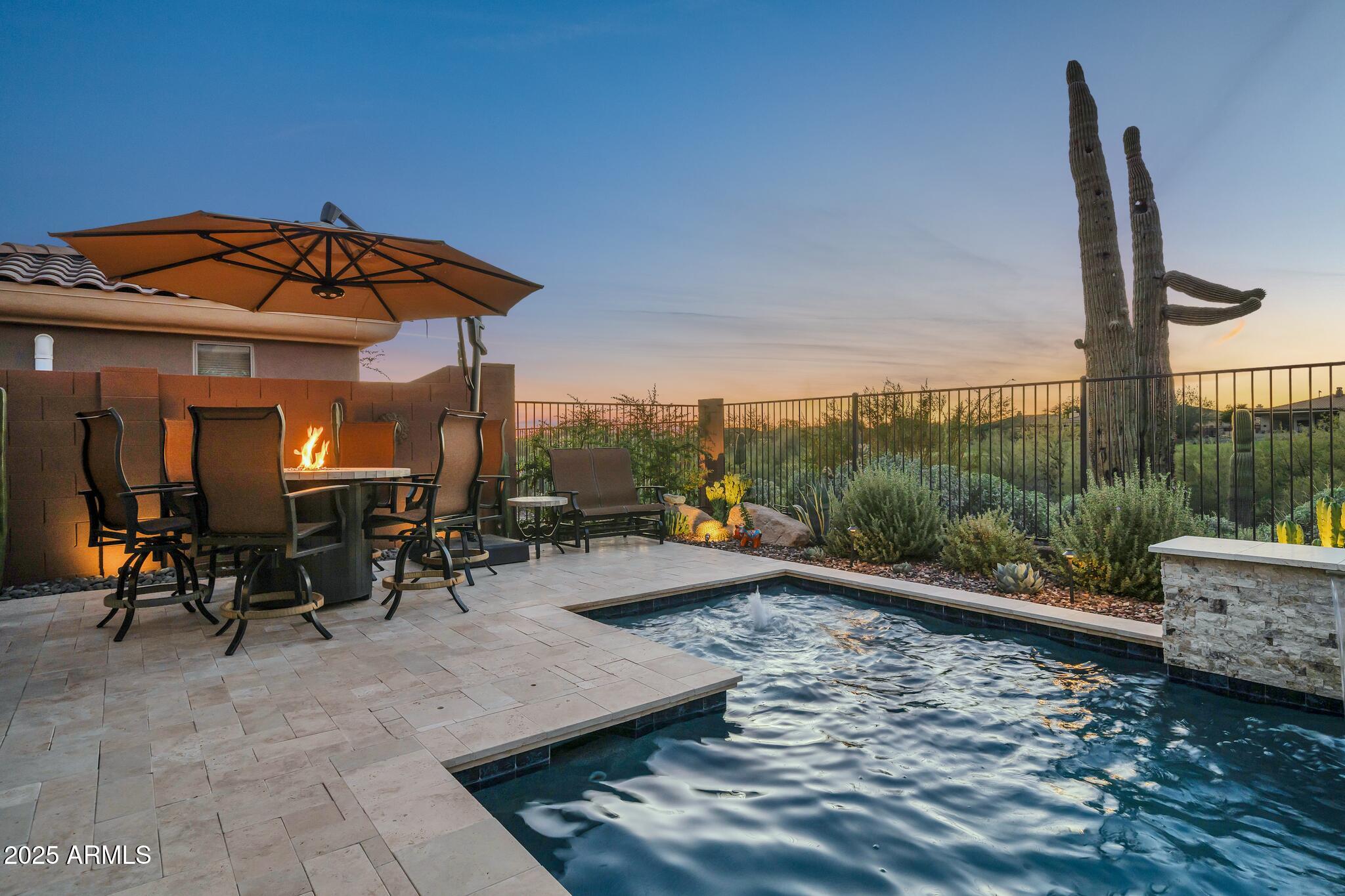 41822 North Crooked Stick Road Anthem, AZ 85086 - Photo 67 of 90 a view of a swimming pool with a patio