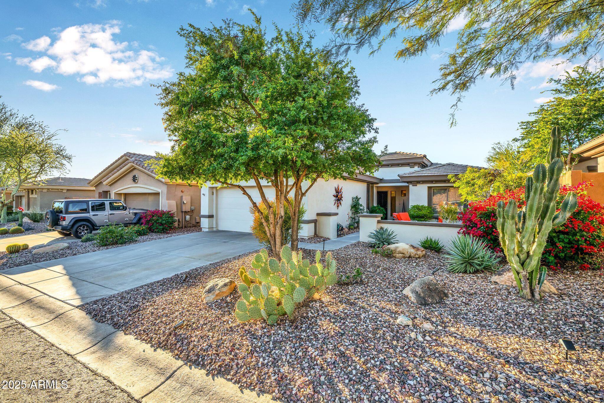 41822 North Crooked Stick Road Anthem, AZ 85086 - Photo 9 of 90 a front view of a house with garden