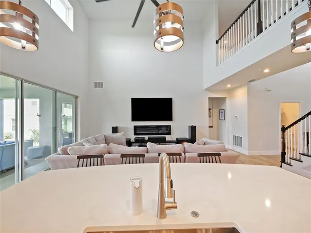a aerial view of a house with swimming pool and furniture