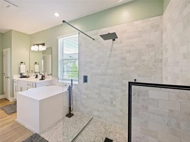 an aerial view of residential houses with outdoor space and swimming pool