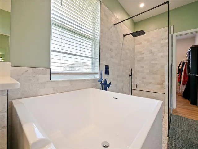 an aerial view of a house with a swimming pool yard and outdoor seating