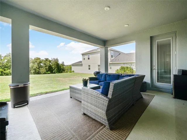 an aerial view of residential houses with outdoor space and swimming pool