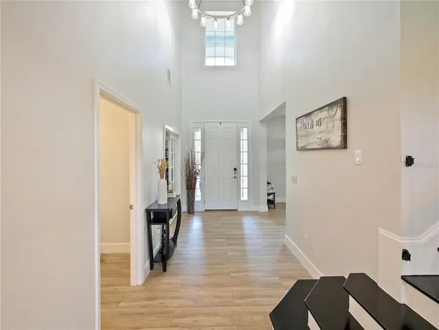 a kitchen with kitchen island sink stove and refrigerator