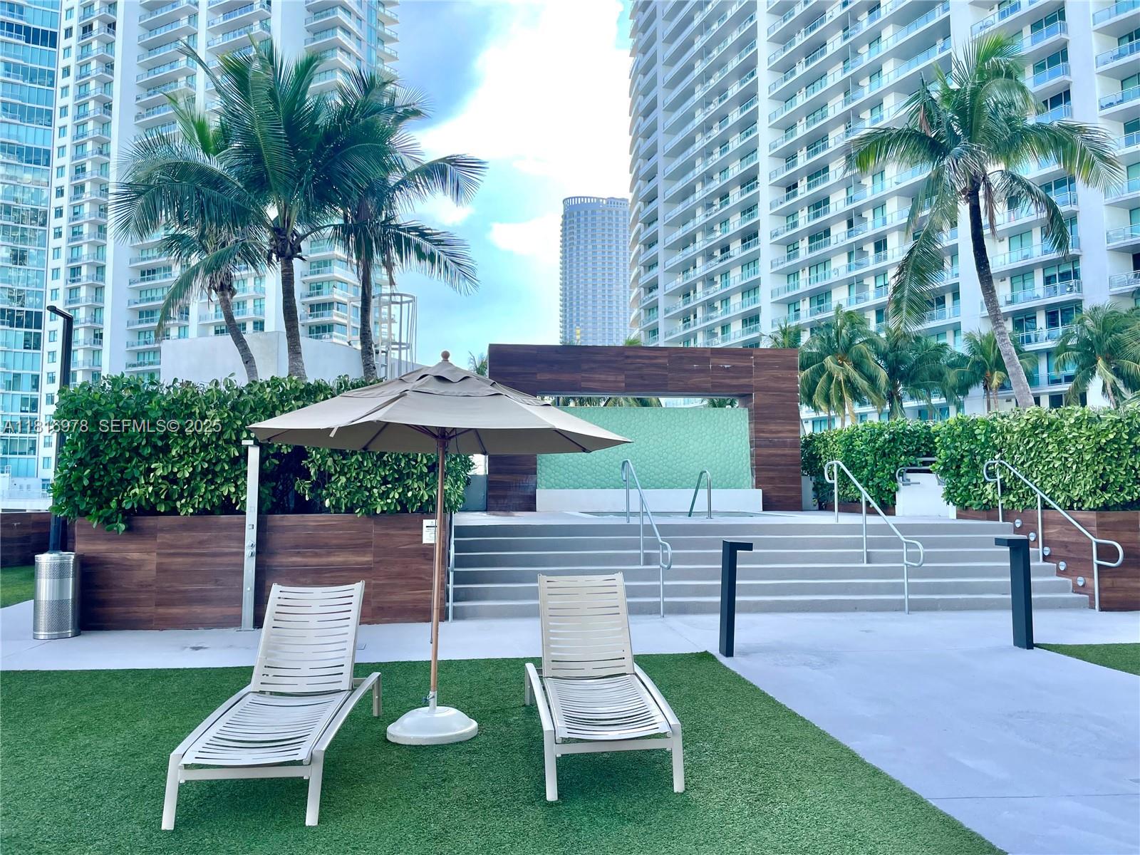 350 South Miami Avenue, Unit 1103 Miami, FL 33130 - Photo 7 of 32 a view of a chair and table in the garden
