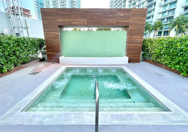 a view of a yard with potted plants