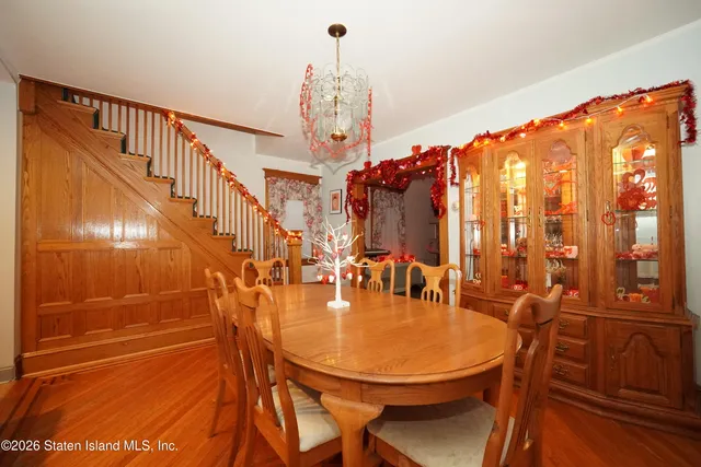 a balcony with table and chairs