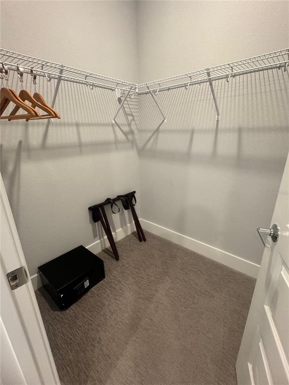 7770 Sandy Ridge Drive, Unit 210 Reunion, FL 34747 - Photo 25 of 42 a view of a room with racks on the wall