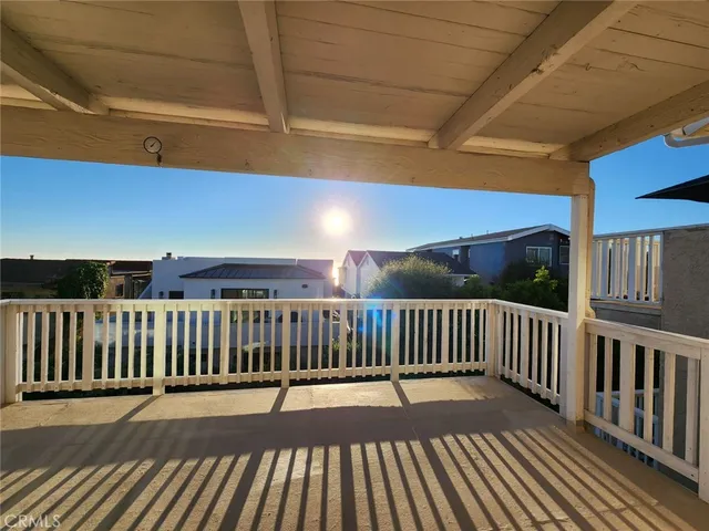 a view of balcony with wooden floor